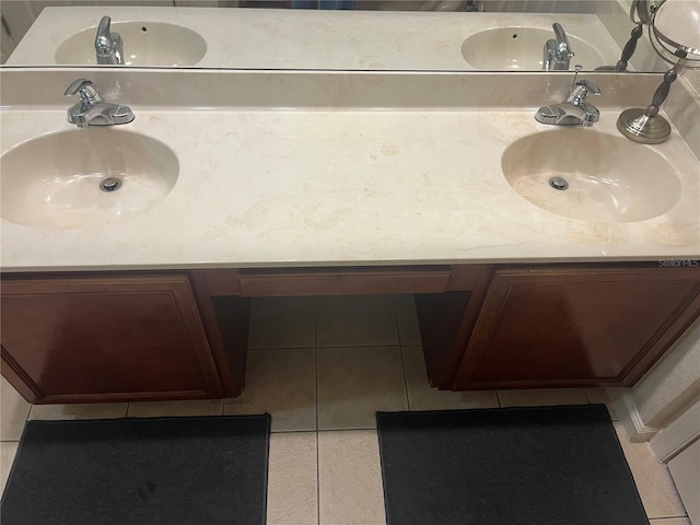 bathroom featuring tile patterned flooring and vanity