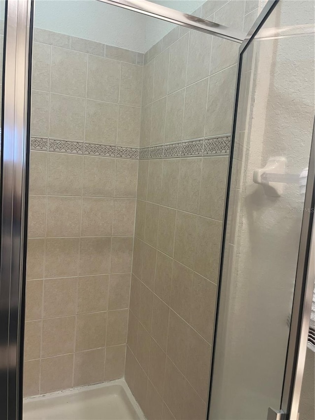 bathroom with an enclosed shower