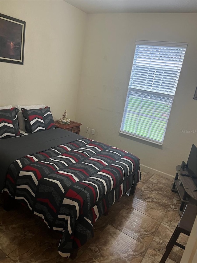 bedroom featuring multiple windows