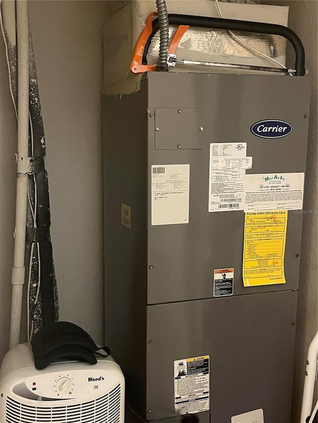 utility room with heating unit