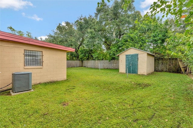 view of yard with a storage shed and central AC