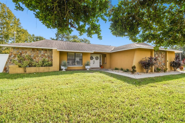 ranch-style home featuring a front yard