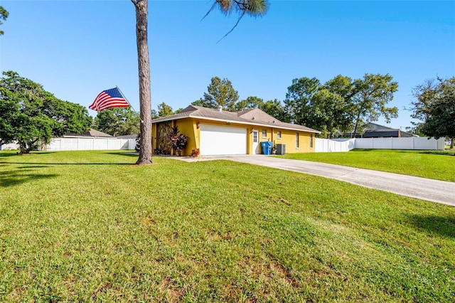 ranch-style home featuring a garage and a front lawn