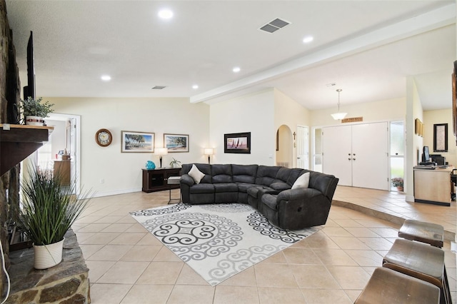 tiled living room with vaulted ceiling