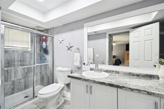 bathroom with vanity, toilet, and an enclosed shower