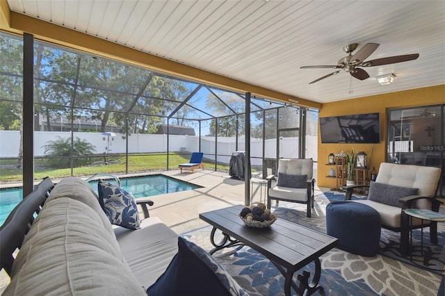 view of patio with a lanai, a fenced in pool, ceiling fan, and an outdoor living space