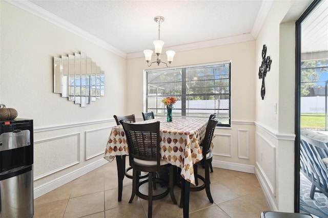 tiled dining area with ornamental molding, a textured ceiling, plenty of natural light, and an inviting chandelier