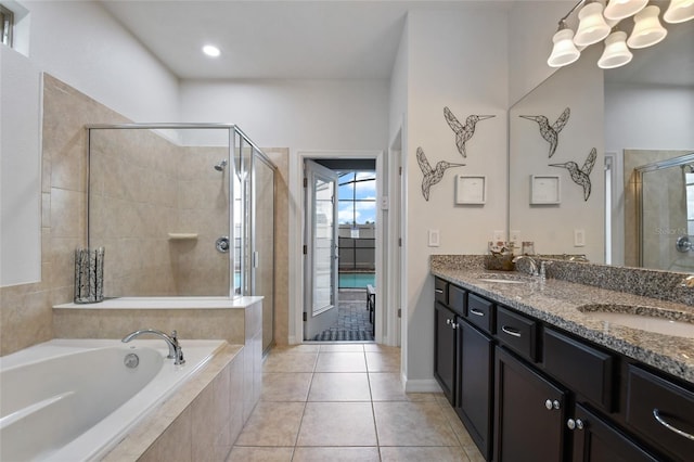 bathroom featuring tile patterned floors, vanity, and independent shower and bath