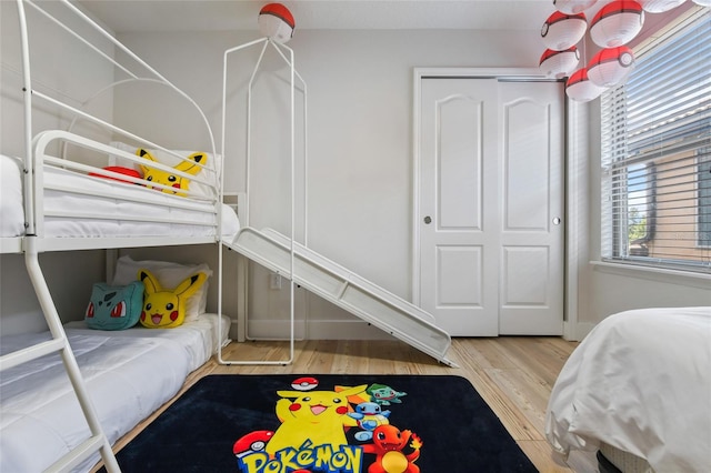 bedroom featuring hardwood / wood-style flooring and a closet