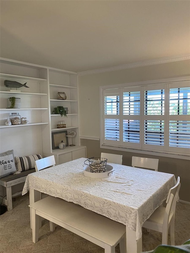 dining area with carpet flooring and a wealth of natural light