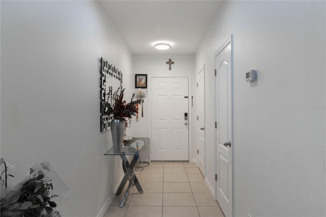 doorway featuring light tile patterned floors