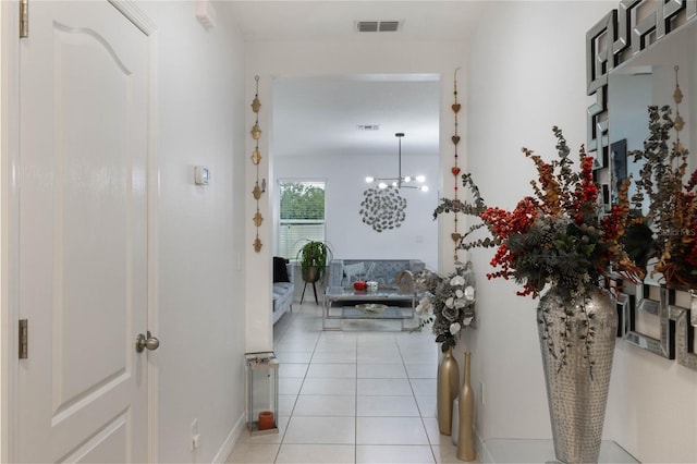 hallway with light tile patterned floors