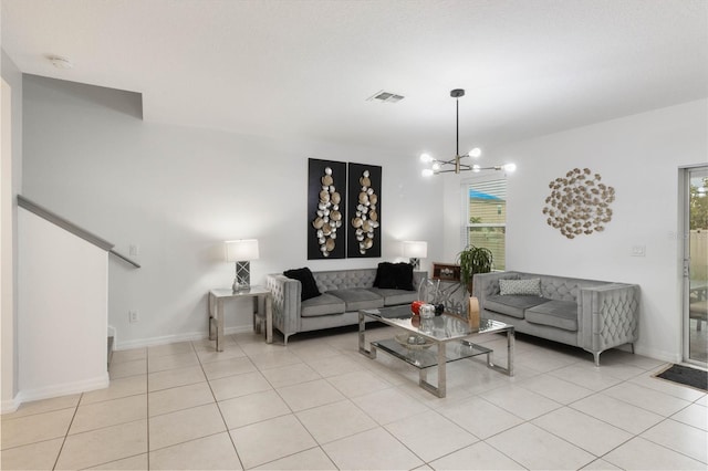 living room featuring a wealth of natural light, a chandelier, and light tile patterned floors