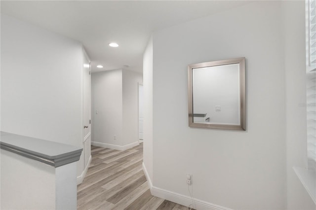 hallway with light wood-type flooring