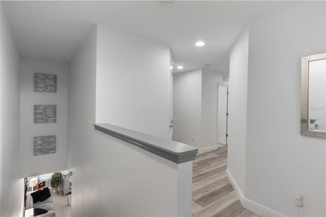 corridor featuring light hardwood / wood-style floors