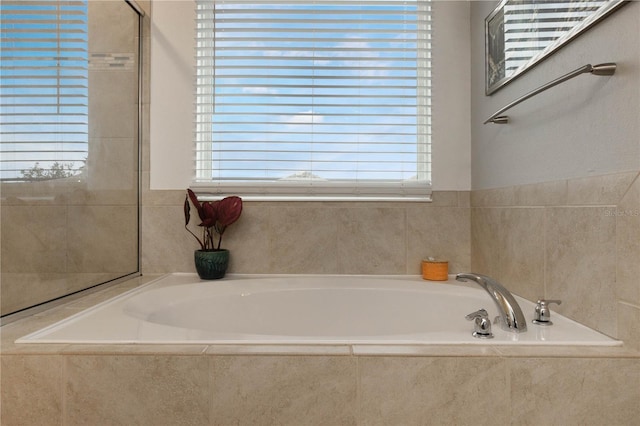 bathroom with tiled bath