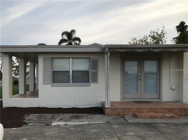 1106 N Hoagland Blvd, Kissimmee, FL 34741 - doorway to property featuring french doors and stucco siding