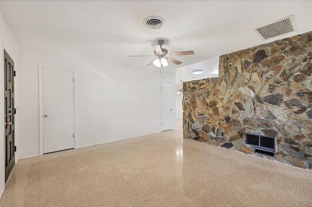 unfurnished living room featuring ceiling fan