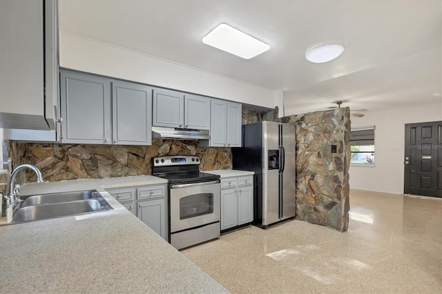 kitchen with gray cabinets, stainless steel appliances, backsplash, and sink