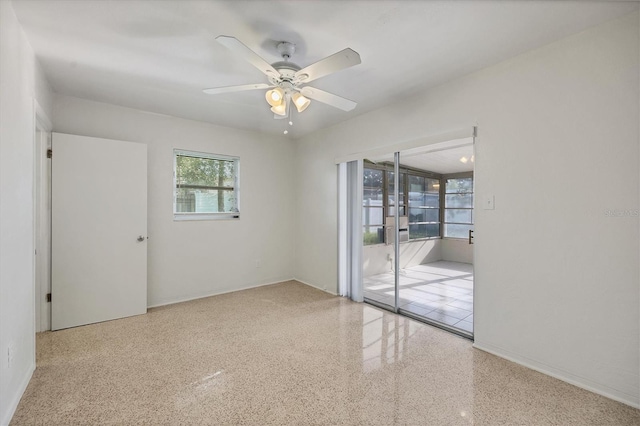 unfurnished room with ceiling fan