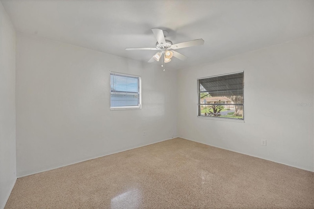 empty room featuring ceiling fan