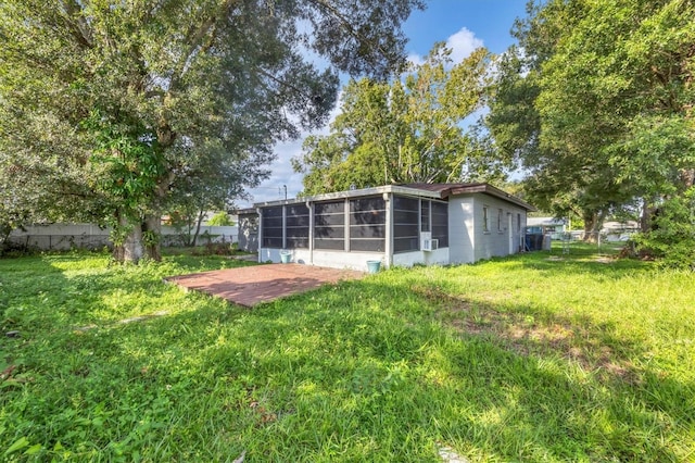 view of yard featuring a sunroom