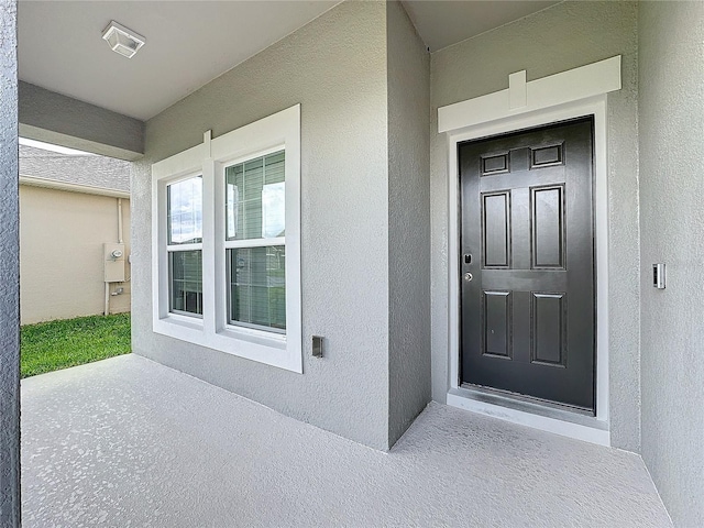 doorway to property with covered porch