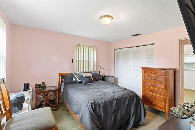 bedroom with carpet floors and a closet