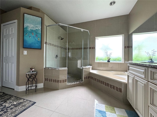 bathroom featuring vanity, separate shower and tub, and tile patterned flooring