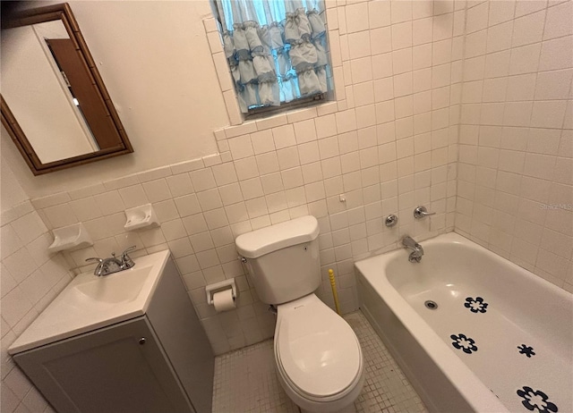 bathroom with tile walls, a bathing tub, vanity, toilet, and tile patterned floors