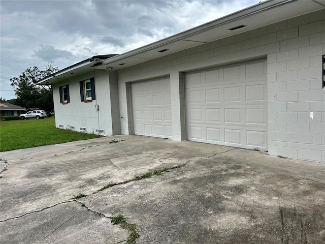 garage with a yard