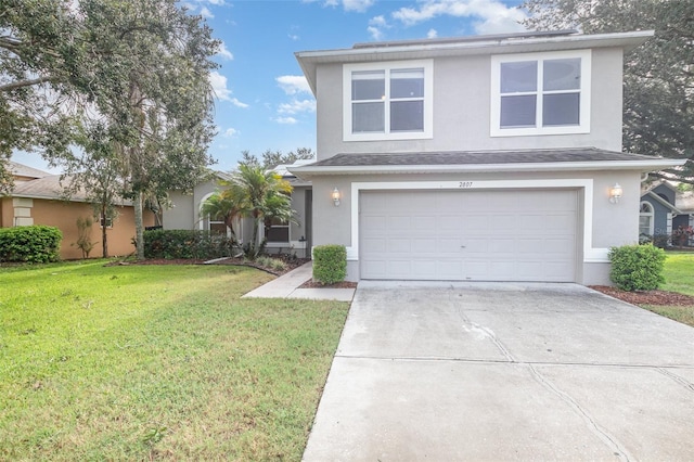 front of property with a front lawn and a garage