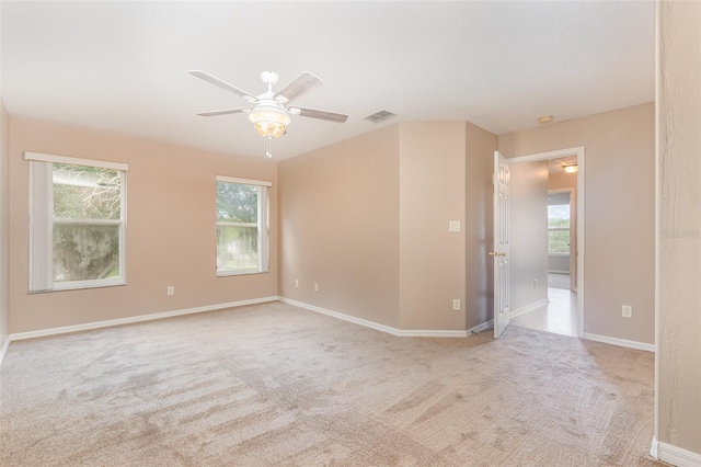 carpeted empty room with ceiling fan