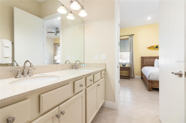 bathroom with tile patterned flooring, ceiling fan, plenty of natural light, and vanity