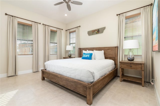 tiled bedroom featuring ceiling fan