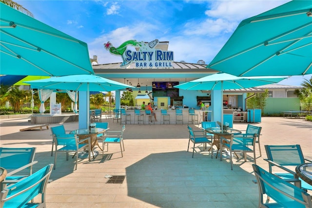 view of patio / terrace with an outdoor bar