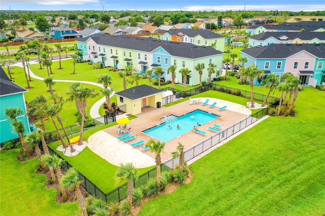 view of swimming pool featuring a patio and a yard