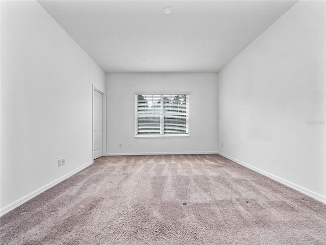 empty room with light colored carpet