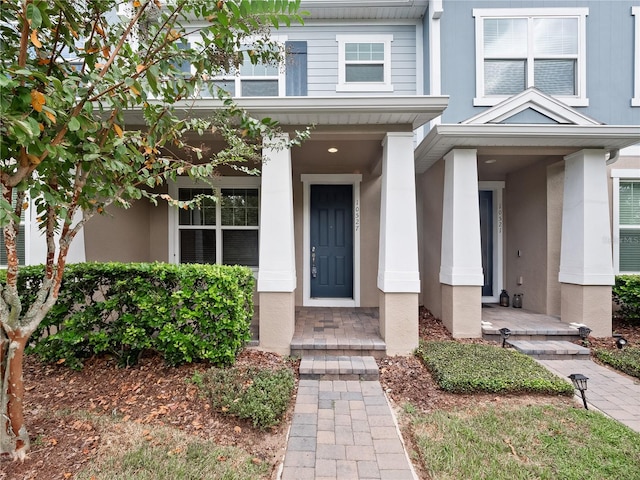 doorway to property with a porch