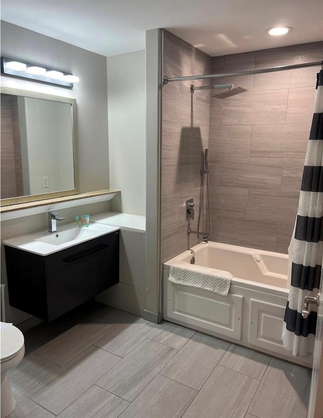 full bathroom with vanity, toilet, and shower / bath combo with shower curtain