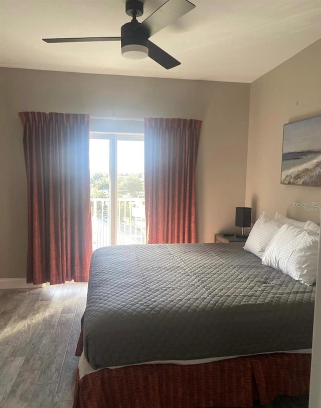 bedroom featuring ceiling fan and hardwood / wood-style flooring