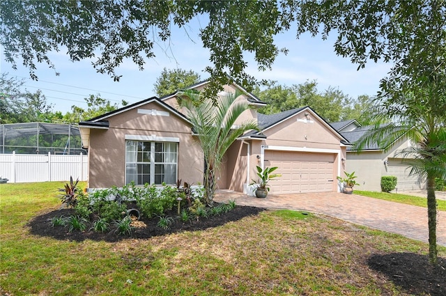 view of front facade with a garage and a front yard