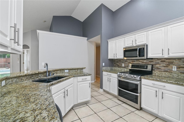 kitchen featuring stainless steel appliances, white cabinets, and sink