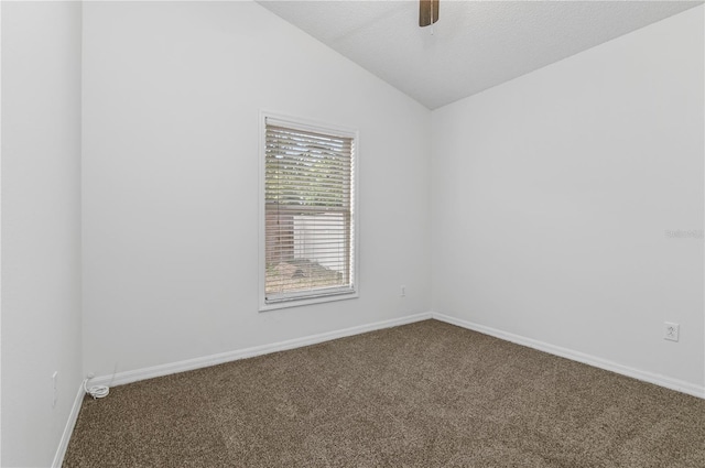 unfurnished room featuring ceiling fan, carpet flooring, a textured ceiling, and vaulted ceiling