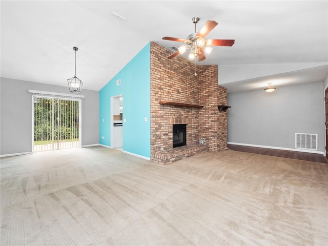 unfurnished living room featuring ceiling fan, a brick fireplace, carpet flooring, and high vaulted ceiling