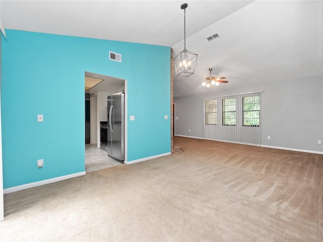 unfurnished living room featuring light carpet, lofted ceiling, and ceiling fan