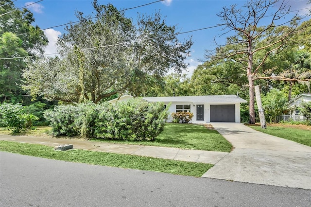 view of front facade with a garage and a front yard