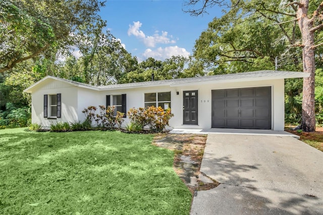 ranch-style house with a front yard and a garage