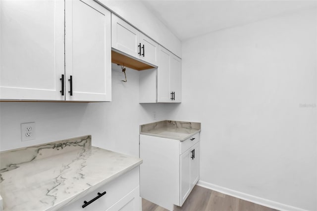 laundry room featuring light hardwood / wood-style flooring