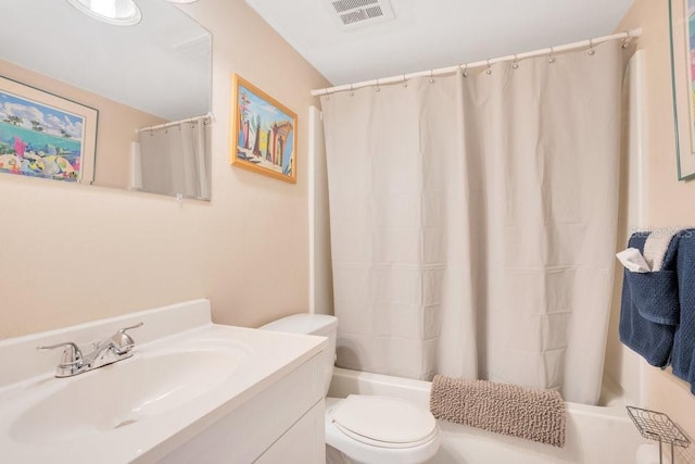 3150 N Atlantic Ave Unit 3-550, Cocoa Beach, FL 32931 - full bathroom featuring toilet, vanity, and shower / bath combination with curtain